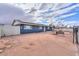 Blue house with solar panels and a spacious yard at 203 E Beech Ave, Casa Grande, AZ 85122