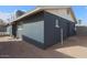 Side view of a dark blue house with a window at 203 E Beech Ave, Casa Grande, AZ 85122