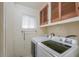 Bright laundry room with washer, dryer, and cabinets at 203 E Beech Ave, Casa Grande, AZ 85122