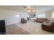 Living room with brown leather sofas and tile flooring at 203 E Beech Ave, Casa Grande, AZ 85122