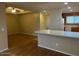 Open dining area with wood-look flooring and access to kitchen at 205 N 74Th St # 205, Mesa, AZ 85207