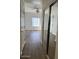 Hallway with mirrored closet and wood floors at 205 N 74Th St # 205, Mesa, AZ 85207