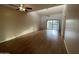 Bright living room with wood-look floors and access to balcony at 205 N 74Th St # 205, Mesa, AZ 85207