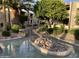 Landscaped courtyard with a serene water feature at 205 N 74Th St # 205, Mesa, AZ 85207