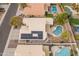 Aerial view showing the home's layout, solar panels and pool at 20967 N 96Th Ln, Peoria, AZ 85382