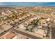 Aerial view of community with numerous homes and pools at 20967 N 96Th Ln, Peoria, AZ 85382