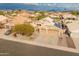 Aerial view of a house with a three-car garage and solar panels, situated in a residential neighborhood at 20967 N 96Th Ln, Peoria, AZ 85382