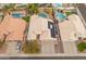 Aerial view of a house with solar panels and a pool at 20967 N 96Th Ln, Peoria, AZ 85382