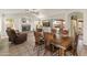 Bright dining area with a wood table and chairs, adjacent to the kitchen at 20967 N 96Th Ln, Peoria, AZ 85382