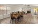 Cozy dining area with wooden table and chairs near a fireplace at 20967 N 96Th Ln, Peoria, AZ 85382