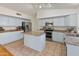 Modern kitchen with stainless steel appliances and light gray cabinets at 20967 N 96Th Ln, Peoria, AZ 85382