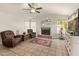 Spacious living room with fireplace and lots of natural light at 20967 N 96Th Ln, Peoria, AZ 85382