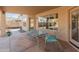 Covered patio with seating area and backyard access at 20967 N 96Th Ln, Peoria, AZ 85382