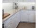 Modern kitchen with white cabinets and quartz countertops at 21282 E Swan Dr, Queen Creek, AZ 85142