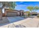 Single-story home with a two-car garage and landscaped front yard at 2227 W Calle Del Sol --, Phoenix, AZ 85085