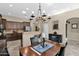 Spacious kitchen featuring dark wood cabinets, granite countertops, and stainless steel appliances at 2227 W Calle Del Sol --, Phoenix, AZ 85085