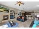 Open concept living room showcasing a fireplace and views into the kitchen at 2227 W Calle Del Sol --, Phoenix, AZ 85085