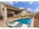 Inviting backyard oasis featuring a sparkling pool, spa, and patio at 2485 S Quaintance St, Gilbert, AZ 85295