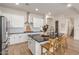 Modern kitchen with white cabinets, large island, and stainless steel appliances at 2485 S Quaintance St, Gilbert, AZ 85295