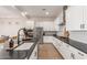 Modern kitchen with white cabinets, large island, and stainless steel appliances at 2485 S Quaintance St, Gilbert, AZ 85295