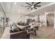 Spacious living room with L-shaped sectional sofa and large windows at 2485 S Quaintance St, Gilbert, AZ 85295