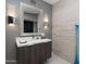 Modern bathroom with floating vanity, updated fixtures, and stylish wall decor at 25150 N Windy Walk Dr # 11, Scottsdale, AZ 85255