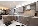 Modern kitchen with stainless steel appliances and stylish backsplash at 25150 N Windy Walk Dr # 11, Scottsdale, AZ 85255