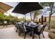 Outdoor patio with dining table, umbrella, and ambient lighting at 25150 N Windy Walk Dr # 11, Scottsdale, AZ 85255