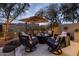 Outdoor patio with fire pit and seating area, perfect for entertaining at 25150 N Windy Walk Dr # 11, Scottsdale, AZ 85255