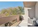 Private patio with seating area and views at 25150 N Windy Walk Dr # 11, Scottsdale, AZ 85255