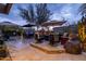 Multi-level patio with seating and fire pit at 25150 N Windy Walk Dr # 11, Scottsdale, AZ 85255