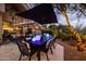 Outdoor patio with dining area and string lights at 25150 N Windy Walk Dr # 11, Scottsdale, AZ 85255