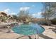 Community pool with a flagstone deck and surrounding landscaping at 25150 N Windy Walk Dr # 11, Scottsdale, AZ 85255