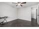 Bright bedroom with ceiling fan and dark tile floors at 2524 S El Paradiso -- # 121, Mesa, AZ 85202