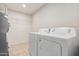 Laundry room with washer, dryer, and shelving at 2524 S El Paradiso -- # 121, Mesa, AZ 85202