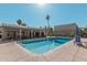 Community pool with lounge chairs and covered patio area at 2524 S El Paradiso -- # 121, Mesa, AZ 85202