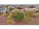 Aerial view of house and backyard with turf at 27573 N 174Th Dr, Surprise, AZ 85387