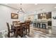 Elegant dining area with a wood table and chandelier at 27573 N 174Th Dr, Surprise, AZ 85387