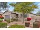 Charming one-story house with a spacious front yard and lush landscaping at 27573 N 174Th Dr, Surprise, AZ 85387