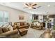 Open living space with leather sofas and a view into the kitchen at 27573 N 174Th Dr, Surprise, AZ 85387