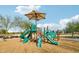 Community playground with shaded playset and wood chips at 27573 N 174Th Dr, Surprise, AZ 85387