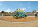 Community playground with a playset and wood-chip ground cover at 27573 N 174Th Dr, Surprise, AZ 85387