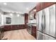 Modern kitchen featuring stainless steel appliances, ample cabinet space, and hardwood floors at 2808 N Granite Reef Rd, Scottsdale, AZ 85257