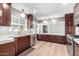 Bright kitchen featuring stainless steel appliances, hardwood floors, and sleek countertops at 2808 N Granite Reef Rd, Scottsdale, AZ 85257