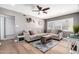 Cozy living room featuring hardwood floors, a comfortable sectional sofa, and modern decor at 2808 N Granite Reef Rd, Scottsdale, AZ 85257