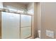 Bathroom with shower/tub combo and frosted glass door at 2822 E Clifton Ct, Gilbert, AZ 85295