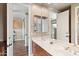 Double vanity bathroom with wood cabinets and mirrors at 2822 E Clifton Ct, Gilbert, AZ 85295