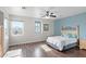 Bright bedroom with wood floors and ceiling fan at 2822 E Clifton Ct, Gilbert, AZ 85295