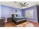 Comfortable bedroom with hardwood floors and ceiling fan at 2822 E Clifton Ct, Gilbert, AZ 85295