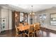 Bright dining room with wooden table and doors leading to pool at 2822 E Clifton Ct, Gilbert, AZ 85295